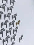 A close up of the dala horse map, where the horse for Stockholm is gold foiled. 